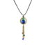 Collier hippie chic ciewenn composé d’un cordon noir, de perles bleues et vertes, d’un cercle en bronze garni d’un bouquet de chaînettes en bronze ornée de perles vertes et bleues et de pampilles en bronze.