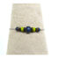Ce Bracelet ethnique Ciewenn est composé d'une chaîne inox, orné d'un mélange harmonieux de perles vertes, noires et camaïeux de bleus