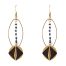 Boucles d'oreilles Ciewenn art déco composées d'un ovale bronze, de perles noires, etd'un carré noir, d'un disque et d'un losange bronze.