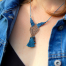 Collier bohème Ciewenn micro macramé composé d'un cordon torsadé et d'une dentelle cuivre décorée d'arabesques noires nouées à la main.