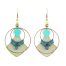 Boucles d'oreilles créoles Ciewenn composées d'un grand et petit d'un cercle bronze, de perles, d'un pétale et d'un micro macramé bleu et vert
